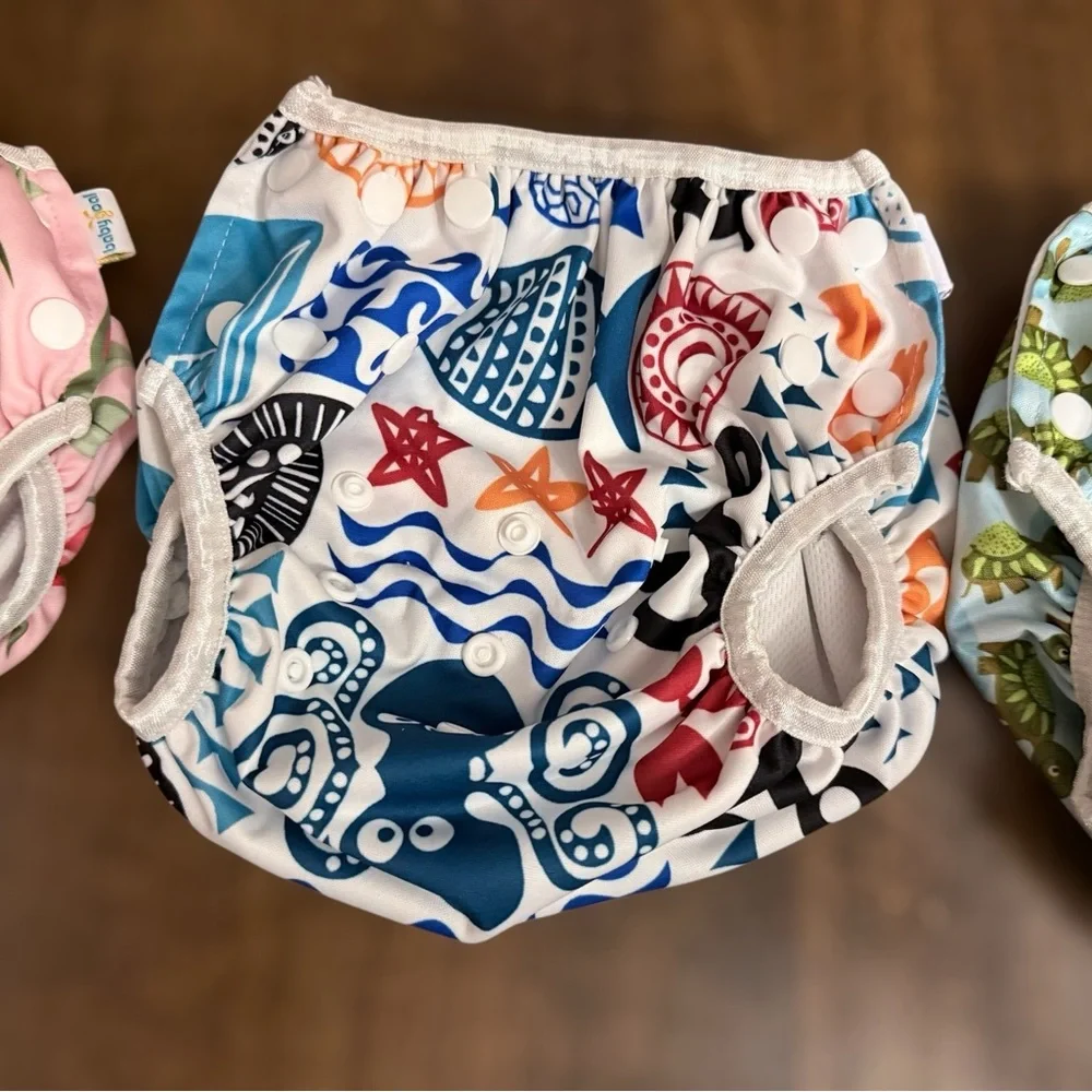 Cloth diaper covers or reusable swim diapers. Set of 3 to Grow with Baby